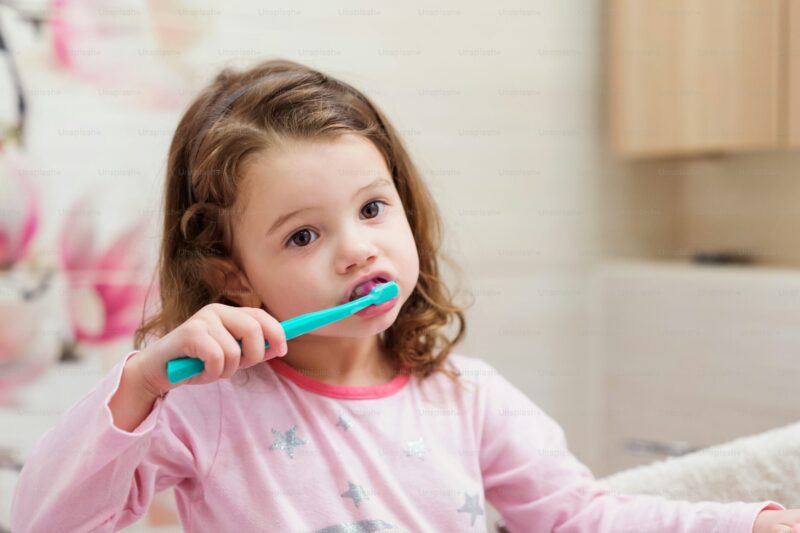 Girl brushing teeth